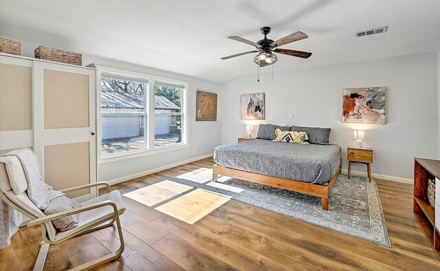 1318 Contour Dr, Burnet, TX 78611 - bedroom with wood finished floors and ceiling fan