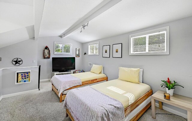 carpeted bedroom with lofted ceiling with beams and baseboards