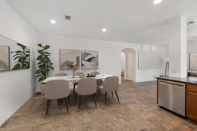 dining area featuring recessed lighting, arched walkways, and visible vents