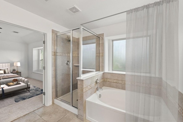 bathroom featuring a shower stall, tile patterned floors, visible vents, a garden tub, and ensuite bathroom