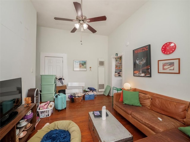 living room featuring ceiling fan and wood finished floors