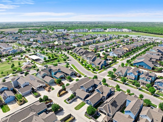 birds eye view of property with a residential view