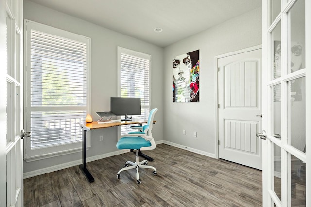 home office with wood finished floors and baseboards