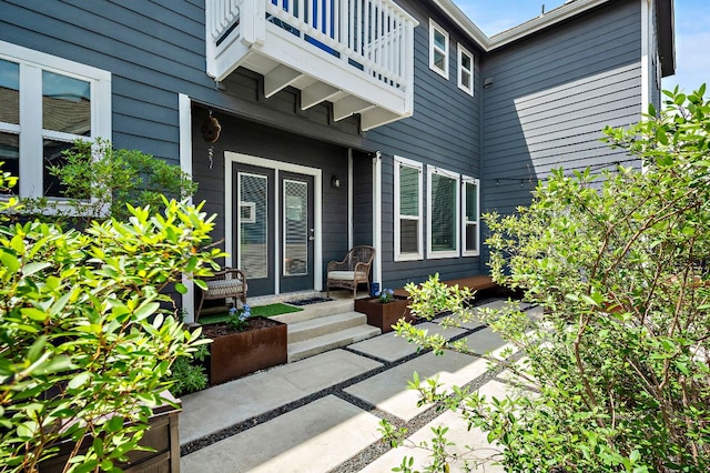 doorway to property featuring a balcony
