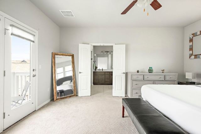bedroom with light carpet, ceiling fan, ensuite bathroom, baseboards, and visible vents