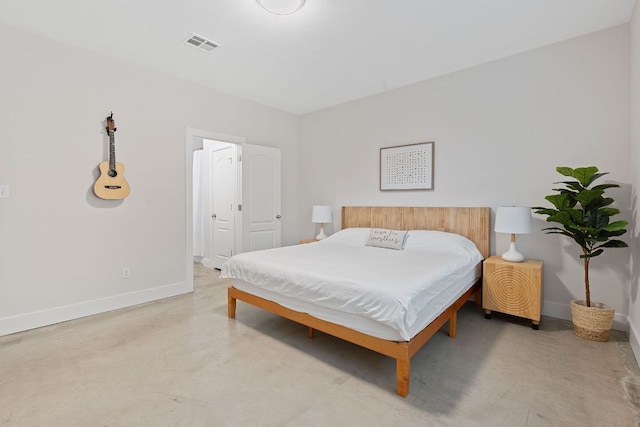 6224 Aviara Dr Unit E14, Austin, TX 78735 - bedroom featuring baseboards, concrete flooring, and ensuite bathroom
