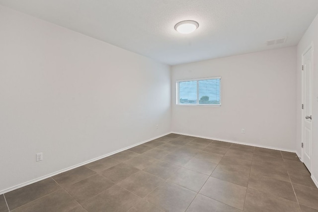 6224 Aviara Dr Unit E14, Austin, TX 78735 - spare room with baseboards and tile patterned floors