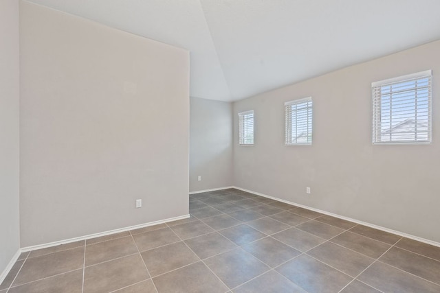 6224 Aviara Dr Unit E14, Austin, TX 78735 - tiled empty room with baseboards and lofted ceiling