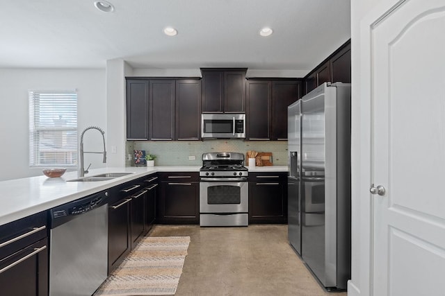 6224 Aviara Dr Unit E14, Austin, TX 78735 - kitchen featuring stainless steel appliances, concrete flooring, backsplash, light countertops, and recessed lighting