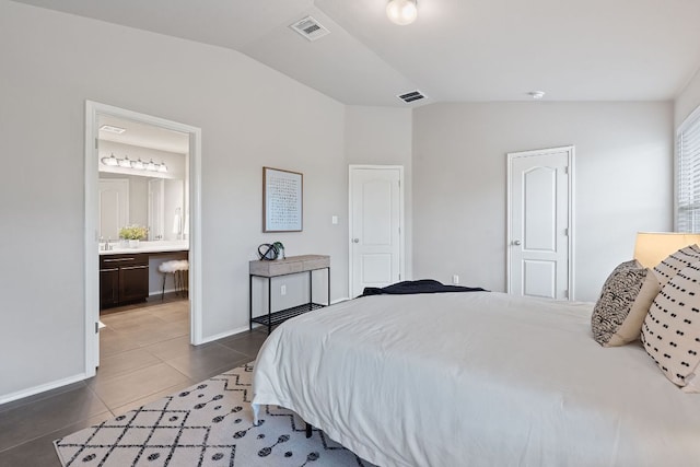 6224 Aviara Dr Unit E14, Austin, TX 78735 - tiled bedroom featuring vaulted ceiling and ensuite bath