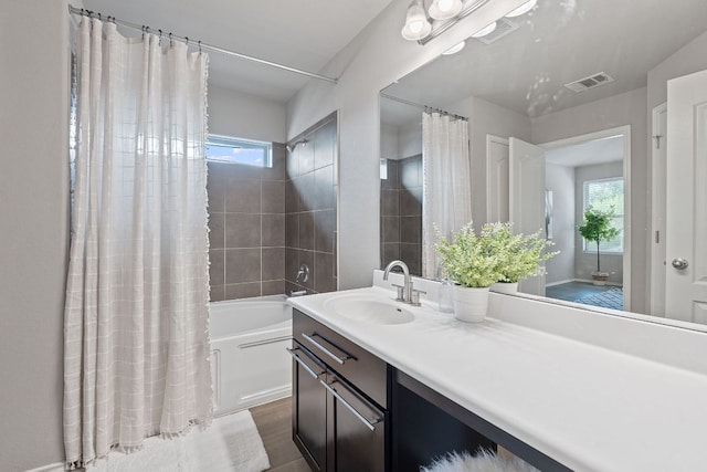 6224 Aviara Dr Unit E14, Austin, TX 78735 - bathroom with shower / bath combo with shower curtain, vanity, and wood finished floors