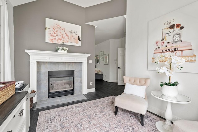 2128 Hilton Head Dr, Round Rock, TX 78664 - sitting room featuring a tiled fireplace, dark wood-style flooring, and vaulted ceiling