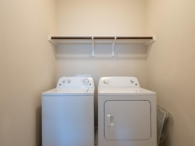 laundry room with washer and dryer and laundry area