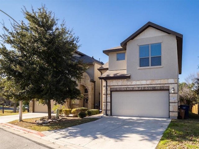 traditional-style home with an attached garage, driveway, stone siding, and stucco siding