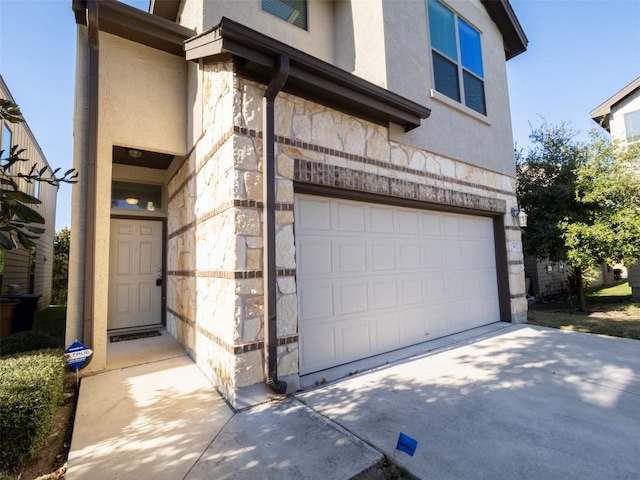 garage featuring driveway