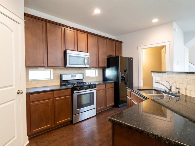 kitchen featuring a sink, recessed lighting, appliances with stainless steel finishes, and tasteful backsplash