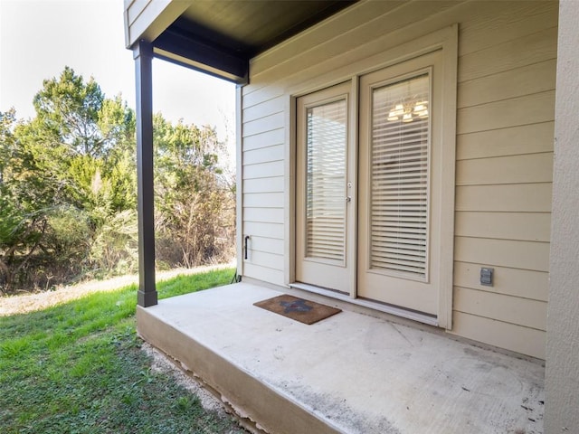 property entrance with a patio area