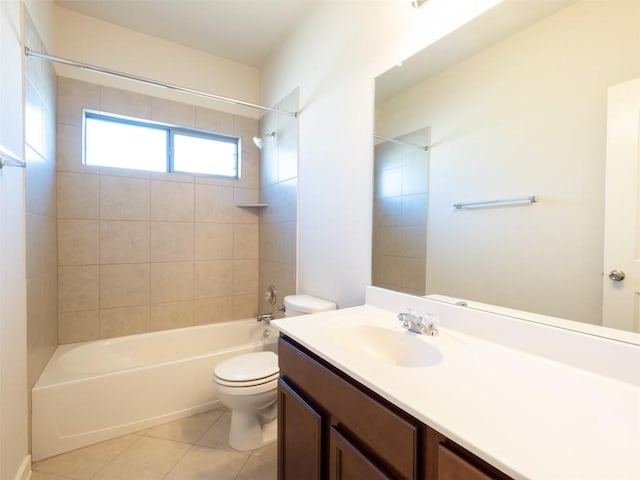 bathroom featuring toilet, vanity, tile patterned floors, and shower / bath combination
