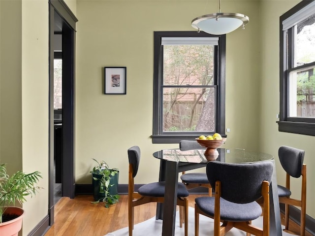 1709 Bouldin Ave, Austin, TX 78704 - dining area with wood finished floors and baseboards