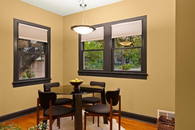 1709 Bouldin Ave, Austin, TX 78704 - dining area featuring plenty of natural light, wood finished floors, and baseboards