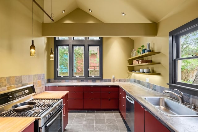 1709 Bouldin Ave, Austin, TX 78704 - kitchen with red cabinets, appliances with stainless steel finishes, a sink, lofted ceiling, and backsplash