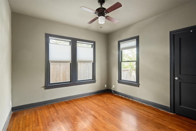 1709 Bouldin Ave, Austin, TX 78704 - spare room featuring light wood-style floors, baseboards, and ceiling fan