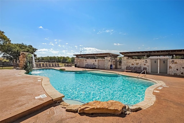 community pool with exterior kitchen and a patio