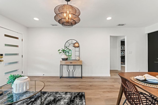 5602 Joe Sayers Ave, Austin, TX 78756 - foyer with light wood-type flooring, recessed lighting, and a chandelier