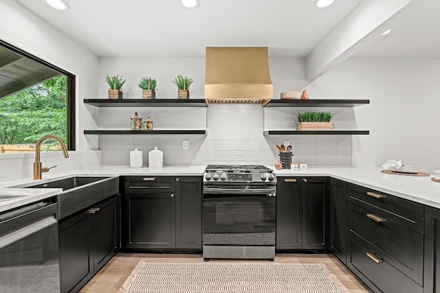 5602 Joe Sayers Ave, Austin, TX 78756 - kitchen with appliances with stainless steel finishes, open shelves, light wood finished floors, decorative backsplash, and recessed lighting