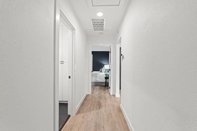 5602 Joe Sayers Ave, Austin, TX 78756 - corridor featuring light wood-style flooring and a textured wall