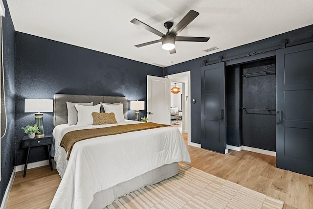 5602 Joe Sayers Ave, Austin, TX 78756 - bedroom with light wood-style floors and ceiling fan