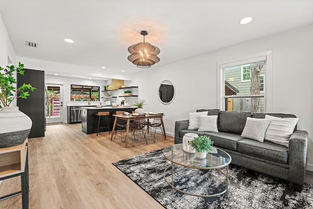 5602 Joe Sayers Ave, Austin, TX 78756 - living room featuring light wood finished floors and recessed lighting