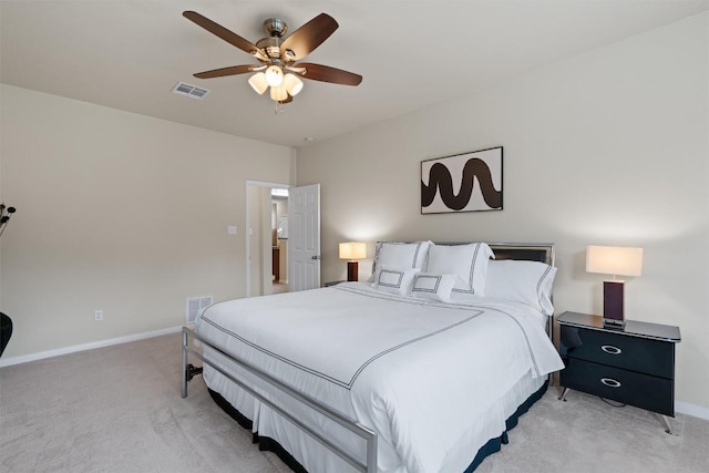 bedroom with baseboards, a ceiling fan, visible vents, and light colored carpet