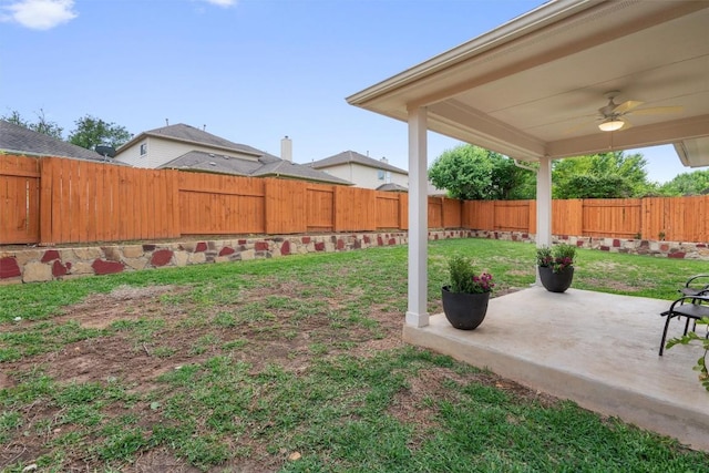 view of yard featuring a ceiling fan, a patio area, and a fenced backyard