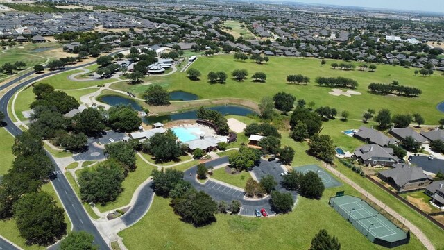 birds eye view of property featuring a water view and a residential view