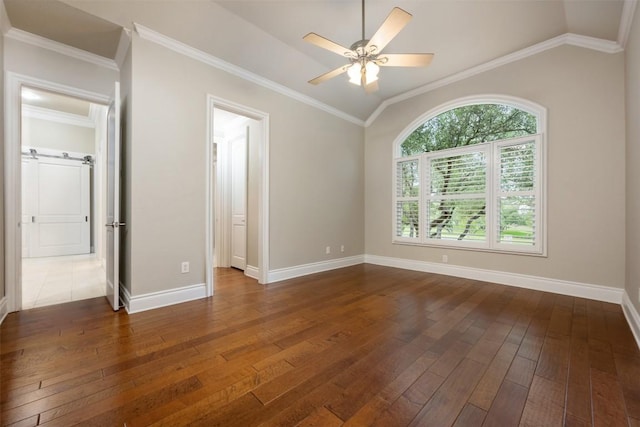 unfurnished room with dark wood finished floors, baseboards, a ceiling fan, and vaulted ceiling