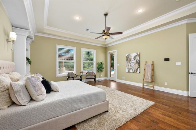 bedroom with visible vents, recessed lighting, crown molding, dark wood-type flooring, and a raised ceiling