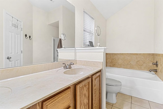bathroom featuring lofted ceiling, tile patterned floors, toilet, vanity, and a bath