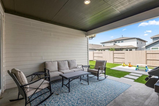 7913 Edmondson Bnd, Austin, TX 78744 - fenced backyard featuring an outdoor hangout area and a patio area