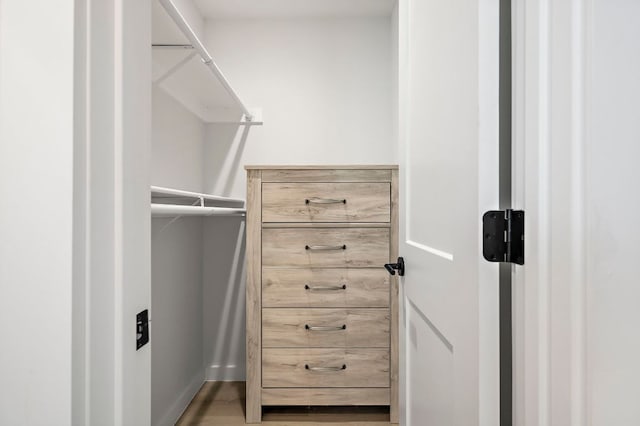 1203 Hollow Creek Dr Unit 101, Austin, TX 78704 - walk in closet featuring wood finished floors