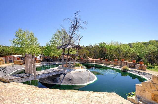 view of swimming pool featuring a fenced in pool