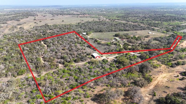 birds eye view of property with a rural view