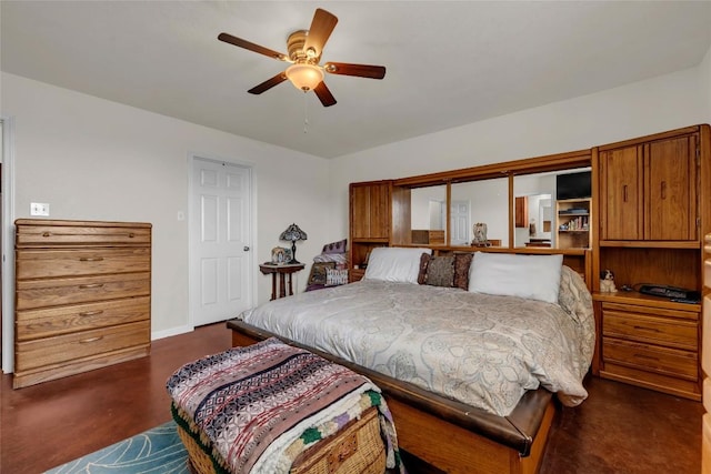 bedroom with ceiling fan and baseboards