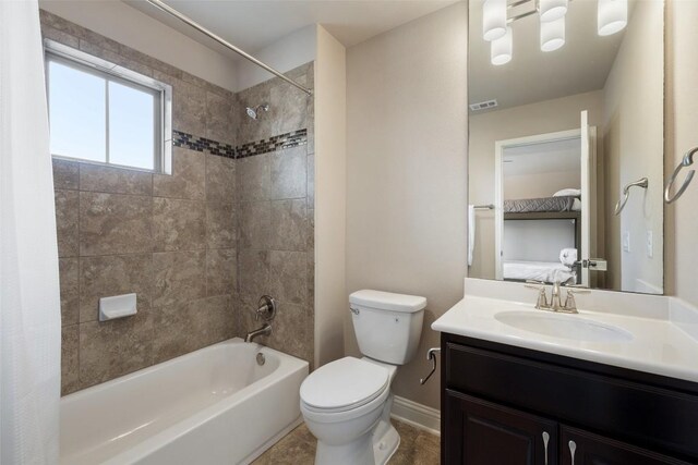 bathroom featuring visible vents, toilet, vanity, shower / tub combo with curtain, and baseboards