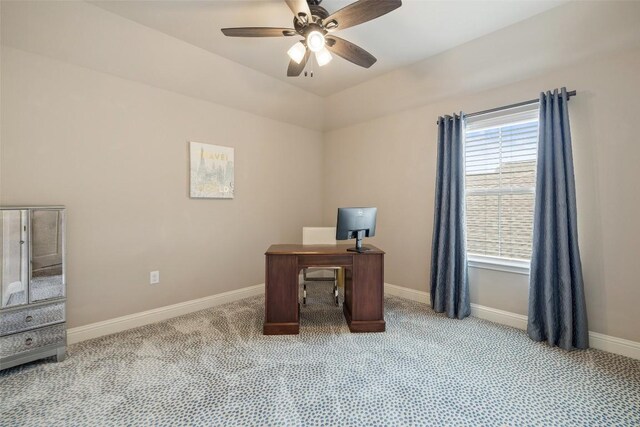 home office with ceiling fan, baseboards, and light carpet