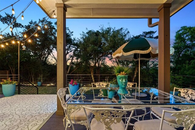 view of patio / terrace featuring fence and outdoor dining area