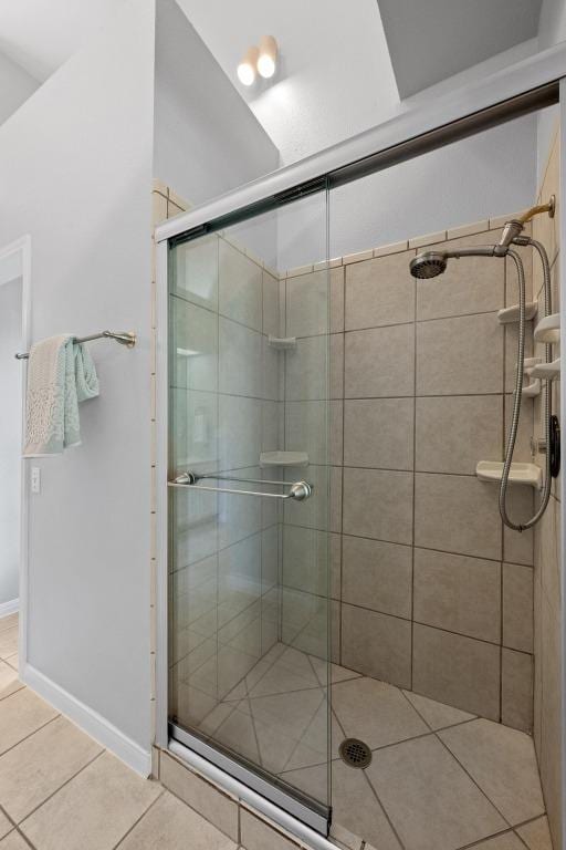 full bath with tile patterned flooring and a stall shower