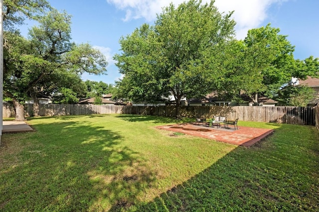 view of yard with a fenced backyard and a patio