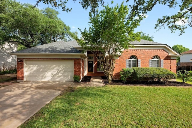 single story home with roof with shingles, a front lawn, concrete driveway, a garage, and brick siding