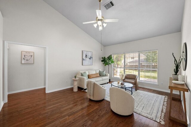 living area with wood finished floors, visible vents, a ceiling fan, baseboards, and high vaulted ceiling